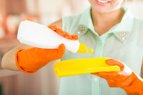 Local cleaning team working in a SW3 apartment corridor